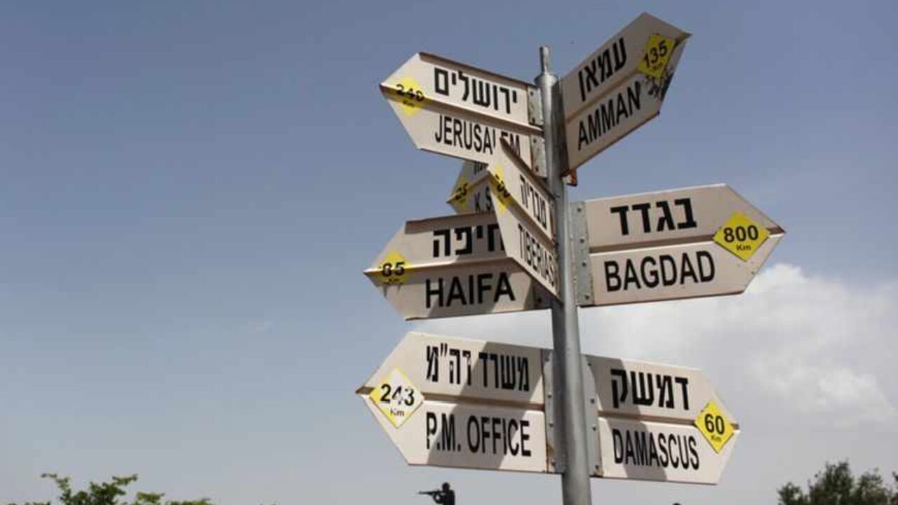 A sign post near Kibbutz Merom Golan in the Golan Heights shows the distance from Israel's northern border to other destinations May 2, 2013. Israel's military said on Tuesday it had called up hundreds of reservists for a drill in northern Israel where tensions are high with neighbours Syria and Lebanon, but a military spokesman said there was no change in the overall security situation. Israel captured the Golan Heights from Syria in the 1967 Middle East war and annexed the territory in 1981, a move not re