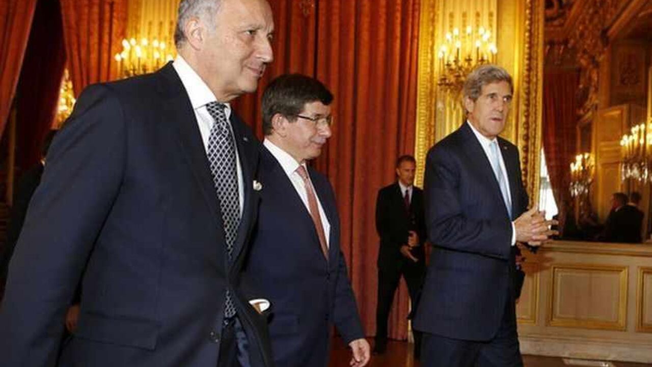 U.S. Secretary of State John Kerry (R) walks with Turkish Foreign Minister Ahmet Davutoglu (C) and French Foreign Minister Laurent Fabius after a meeting regarding Syria, at the Quai d'Orsay in Paris September 16, 2013. The United States, Britain, France and Russia agree Syria must face consequences if it does not fully comply with a U.N. resolution to ensure a handover of its chemical weapons, Kerry said on Monday.   REUTERS/Larry Downing  (FRANCE - Tags: POLITICS CIVIL UNREST) - RTX13N9S