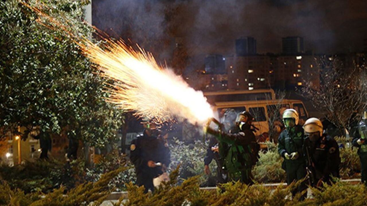 Police fire tear gas to disperse university students demonstrating against reconstruction plans that include a part of their campus in Ankara early October 19, 2013. The municipality plan, opposed by the students, involves building a road across the Middle East Technical University campus and uprooting a large number of trees in the area. REUTERS/Umit Bektas (TURKEY - Tags: POLITICS CIVIL UNREST EDUCATION ENVIRONMENT TPX IMAGES OF THE DAY BUSINESS CONSTRUCTION) - RTX14GBU
