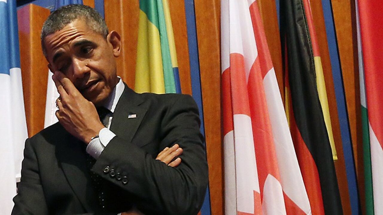 U.S. President Barack Obama wipes his eye after the closing session of the Nuclear Security Summit in The Hague March 25, 2014. World leaders called on Tuesday for countries to minimise their stocks of highly enriched nuclear fuel to help prevent al Qaeda-style militants from obtaining atomic bombs, at the end of a two-day summit overshadowed by the crisis in Ukraine.    REUTERS/Frank Augstein/Pool (NETHERLANDS  - Tags: POLITICS)   - RTR3IJ79