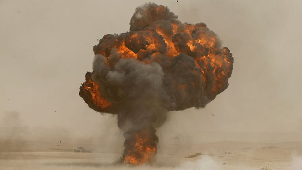 An explosion is seen during Saudi security forces' Abdullah's Sword military drill in Hafar Al-Batin, near the border with Kuwait April 29, 2014.  REUTERS/Faisal Al Nasser (SAUDI ARABIA - Tags: MILITARY) - RTR3N4BI