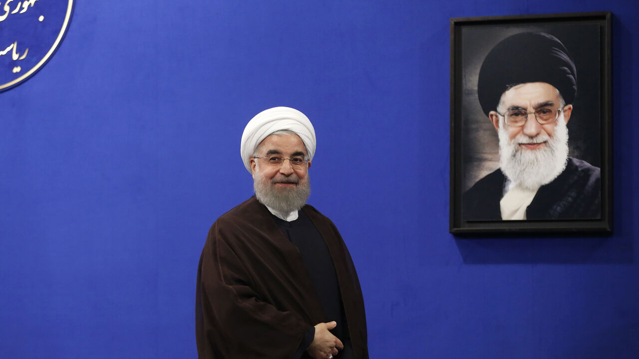 Newly re-elected Iranian President Hassan Rouhani gestures after delivering a televised speech in the capital Tehran on May 20, 2017. A portrait of Iran's Supreme Leader Ayatollah Ali Khamenei is seen in the background.
Iranians have chosen the "path of engagement with the world" and rejected extremism, President Hassan Rouhani said following his resounding re-election victory. / AFP PHOTO / ATTA KENARE        (Photo credit should read ATTA KENARE/AFP/Getty Images)