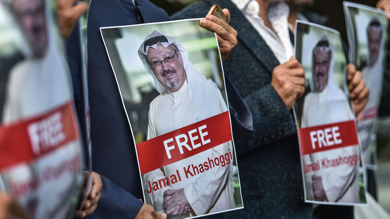 TOPSHOT - Protestors hold pictures of missing journalist Jamal Khashoggi during a demonstration in front of the Saudi Arabian consulate in Istanbul on October 5, 2018. - Jamal Khashoggi, a veteran Saudi journalist who has been critical towards the Saudi government has gone missing after visiting the kingdom's consulate in Istanbul on October 2, 2018, the Washington Post reported. (Photo by OZAN KOSE / AFP)        (Photo credit should read OZAN KOSE/AFP/Getty Images)