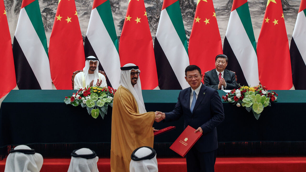 Abu Dhabi's Crown Prince Sheikh Mohammed bin Zayed Al Nahyan and Chinese President Xi Jinpin applaud as they witness a signing ceremony at the Great Hall of the People in Beijing, Monday, July 22, 2019. Andy Wong/Pool via REUTERS - RC1F7C215B10
