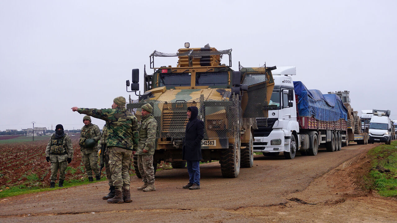 Turkish military vehicles are pictured in the town of Binnish in Syrias northwestern province of Idlib, near the Syria-Turkey border on February 12, 2020. - Russian President Vladimir Putin and Turkish leader Recep Tayyip Erdogan discussed de-escalation of the Syrian crisis, saying Russian-Turkish agreements should be implemented in full, the Kremlin said."The importance was noted of the full implementation of existing Russian-Turkish agreements," the Kremlin said in a statement after the Putin-Erdogan phon
