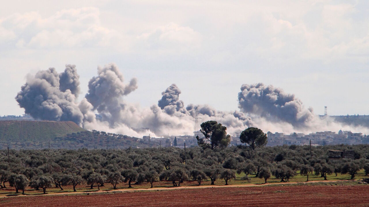 TOPSHOT - Smoke billows over the village of Qaminas, about 6 kilometres southeast of Idlib city in northwestern Syria, following reported Russian air strikes in northwestern Syria on March 1, 2020. (Photo by Ibrahim YASOUF / AFP) (Photo by IBRAHIM YASOUF/AFP via Getty Images)