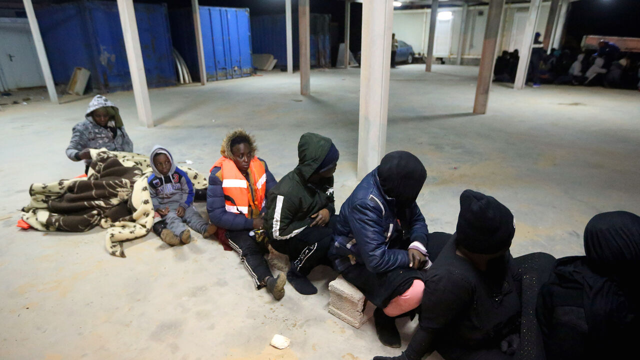 Migrants are pictured in the Libyan town of Tajura, about 14 kilometres east of the capital Tripoli, after some 240 illegal migrants of different African nationalities were rescued from the Mediterranean late on February 18, 2020. (Photo by Mahmud TURKIA / AFP) (Photo by MAHMUD TURKIA/AFP via Getty Images)