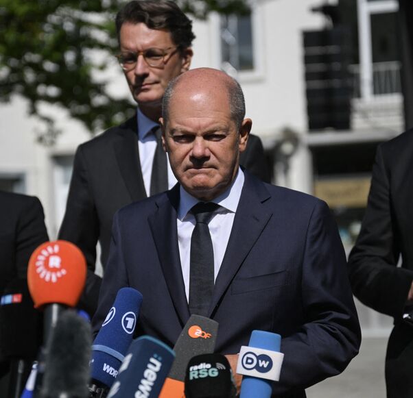 German Chancellor Olaf Scholz addresses media after a visit at the site of a knife attack in Solingen, Western Germany, on August 26, 2024. 