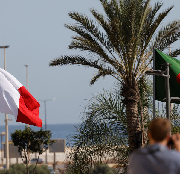 This picture taken on Aug. 25, 2022 shows the France flag and Algeria flag ahead of the arrival of French President in Algiers for an official visit. 