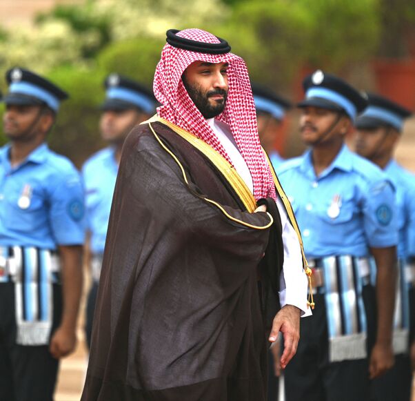 Saudi Arabia's Crown Prince and Prime Minister Mohammed bin Salman (C) inspects a guard of honour during a ceremonial reception at the President House a day after the G20 summit in New Delhi on September 11, 2023. (Photo by Money SHARMA / AFP) (Photo by MONEY SHARMA/AFP via Getty Images)