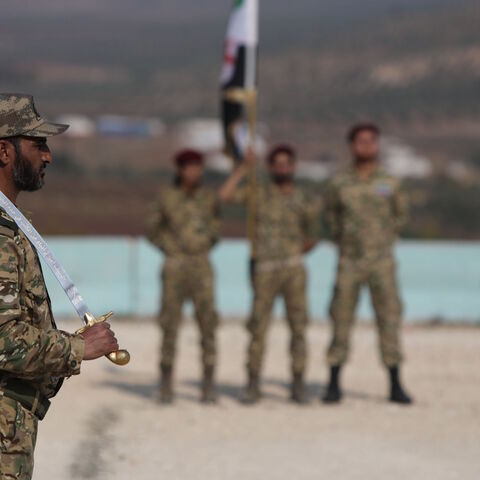 Turkish-backed Syrian fighters of the Sultan Murad Turkoman brigade are pictured during a military show in the Afrin region in the rebel-held northern countryside of Syria's northern Aleppo province on Nov. 17, 2020. 