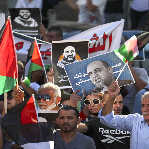 Palestinian protesters rally denouncing the Palestinian Authority (PA) in the aftermath of the death of activist Nizar Banat while in the custody of PA security forces, Ramallah, West Bank, July 17, 2021.