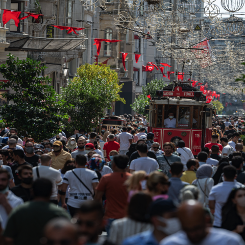 Pedestrians walk on Istiklal Street, the main shopping street in Istanbul, on the fourth day of the Eid-al-Adha holiday on July 23, 2021.