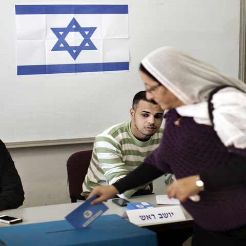 A Druze woman casts her ballot in the northern village of Maghar, Israel, Jan. 22, 2013.