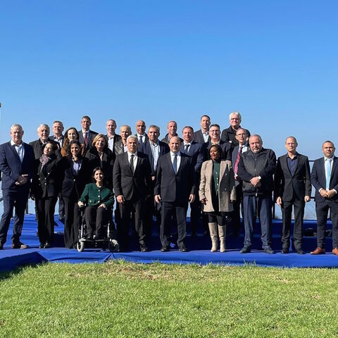 The Israeli government poses following the Dec. 26 weekly Cabinet meeting, which took place at Kibbutz Mevo Hama in the Golan Heights. 