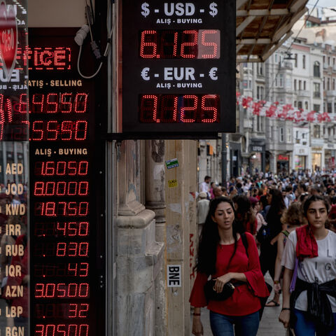 People walk past a currency exchange office on Aug. 29, 2018 in Istanbul, Turkey. 