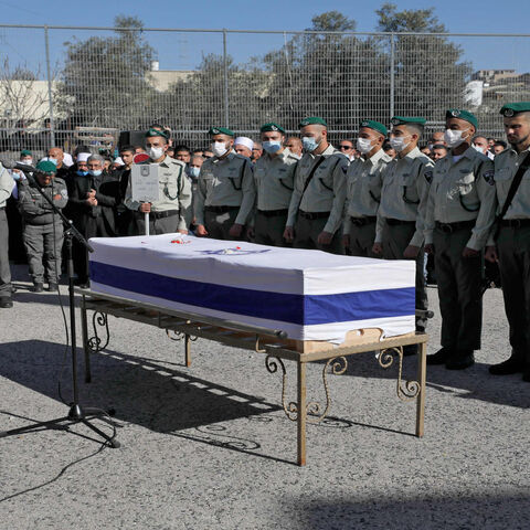 Israeli policemen and family members of Israeli border police officer Yezen Falah attend his funeral in the Druze village of Kisra-Sumei, northern Israel, March 28, 2022.