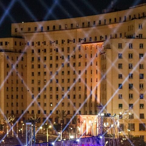 The Mugamma (Complex) administrative government building towering over Cairo's Tahrir Square is lit up on April 3, 2021.