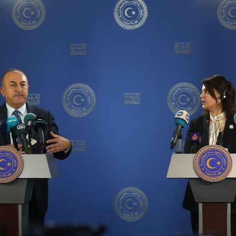 Libyan Foreign Minister Najla al-Mangoush (R) and Turkish Foreign Minister Mevlut Cavusoglu.