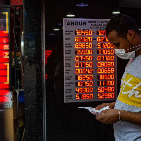 A man wearing a face mask leaves after changing money at an exchange office in Istanbul, Turkey, July 29, 2020.