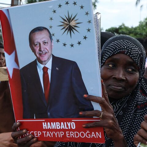 Somalis celebrate the victory of Turkish President Recep Tayyip Erdogan after he won the presidential run-off election during the celebrations organised by the government in Mogadishu, on May 29, 2023. 