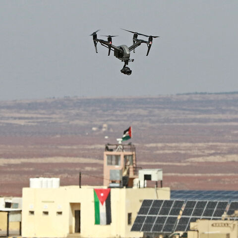 A picture taken during a tour origanized by the Jordanian Army shows a drone flying over an observation post along the border with Syria, on February 17, 2022. - Drug trafficking from Syria into Jordan is becoming "organised" with smugglers stepping up operations and using sophisticated equipment including drones, Jordan's army said, warning of a shoot-to-kill policy. Since the beginning of this year, Jordan's army has killed 30 smugglers and foiled attempts to smuggle into the kingdom from Syria 16 million