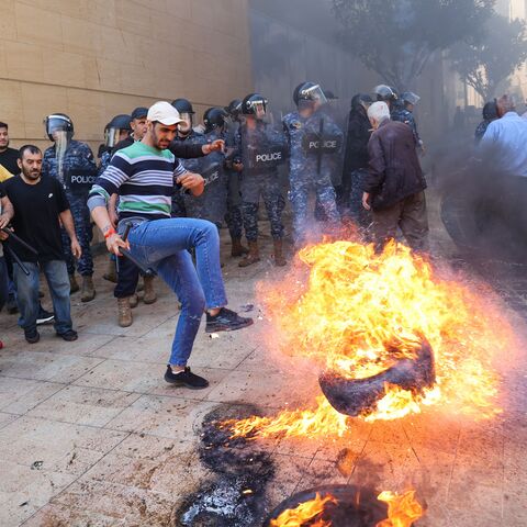  Lebanese protesters burn tyres during a demonstration called for by the banks depositors committee against monetary policies, on May 9, 2023. Lebanon's economic meltdown, described by the World Bank as one of the worst in recent global history, has plunged most of the population into poverty according to the United Nations. (Photo by ANWAR AMRO / AFP) (Photo by ANWAR AMRO/AFP via Getty Images)