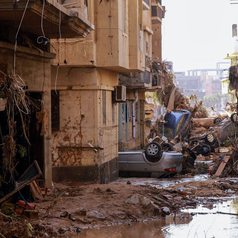 Overturned cars lay among other debris caused by flash floods in Derna, eastern Libya, on Sept. 11, 2023. 