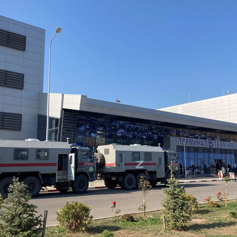 This photograph shows Russian National Guard (Rosgvardiya) vans parked at the airport in Makhachkala on October 30, 2023. Russian police on October 30, 2023 said they had arrested 60 people suspected of storming an airport in the Muslim-majority Caucasus republic of Dagestan, seeking to attack Jewish passengers coming from Israel. (Photo by STRINGER / AFP) (Photo by STRINGER/AFP via Getty Images)