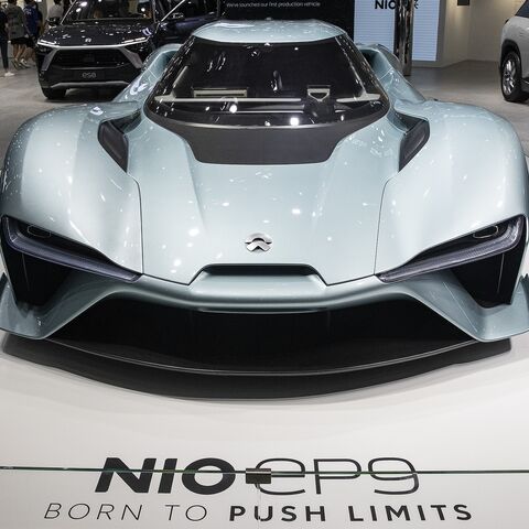 Attendees look around the at NIO EP9 during the 2022 Central China International Auto Show on July 14, 2022, in Wuhan, Hubei province, China.