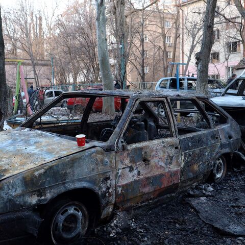 This photograph taken on January 17, 2024 shows destroyed cars in the courtyard of a residential building following a drone attack in Odesa. Kyiv said on Jan. 17, 2024 that Russia had launched 20 Iranian-designed attack drones at targets in southern Ukraine overnight, and that its air defense systems destroyed all but one. 