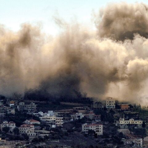 Smoke billows above the village of Khiyam, in southern Lebanon, during an Israeli bombardment near the Lebanese border, Feb. 8, 2024.
