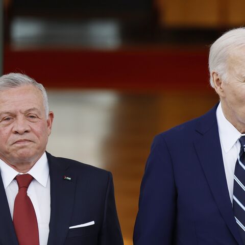 King of Jordan Abdullah II ibn Al Hussein and US President Joe Biden pose for a photo after the king's arrival on the North Portico of the White House on Feb. 12, 2024, in Washington.