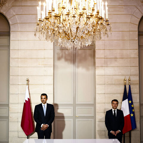 French President Emmanuel Macron (R) and Qatar's Emir Sheikh Tamim bin Hamad al-Thani attend an agreement signing ceremony at the Elysee Palace, in Paris on Feb. 27, 2024.