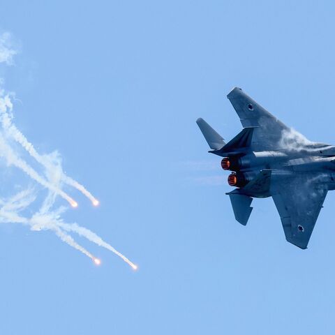 An F-15E Strike Eagle fighter aircraft of the Israeli Air Force Aerobatic team flies during a rehearsal for the upcoming Independence Day air show in Tel Aviv on April 24, 2023.