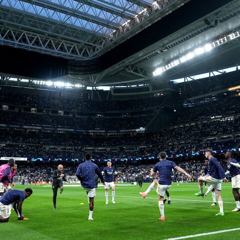 A general view as players of Real Madrid warm up prior to the UEFA Champions League quarter-final first leg match between Real Madrid CF and Manchester City at Santiago Bernabeu Stadium on April 09, 2024, in Madrid, Spain.