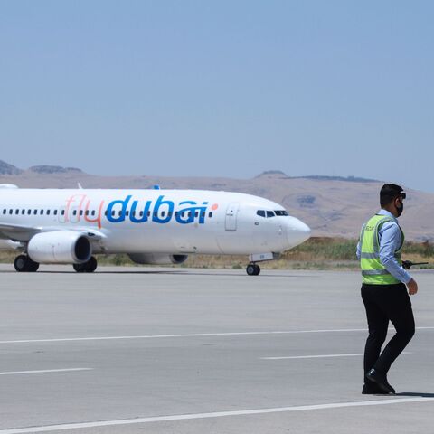 A Boeing 737 aircraft of Emirati airline FlyDubai is seen on the tarmac of Sulaimaniyah Airport in Iraq's autonomous Kurdish region on August 2, 2020, as the airport resumes flight operations following the COVID-19 lockdown.