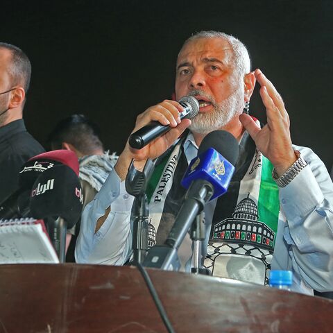 Hamas' political bureau chief Ismail Haniyeh addresses supporters during a rally in solidarity with the Palestinians outside Qatar's Imam Muhammad Abdel-Wahhab Mosque in the capital Doha on May 15, 2021. - Qatar's Foreign Minister hosted the political chief of Palestinian Islamist movement Hamas and called for an end to Israel's bombardment of Gaza, state media said. (Photo by KARIM JAAFAR / AFP) (Photo by KARIM JAAFAR/AFP via Getty Images)
