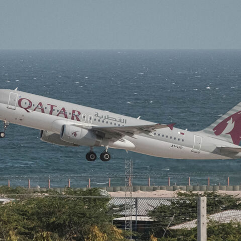 A Qatar Airways plane takes off from Aden Adde International Airport in Mogadishu, Somalia, Feb. 12, 2022.