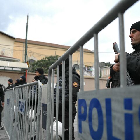 Turkish anti riot police officers block the street of Santa Maria church after an attack in Istanbul, on Jan. 28, 2024. 