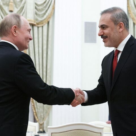 In this pool photograph distributed by Russian state agency Sputnik, Russia's President Vladimir Putin (L) attends a meeting with Turkish Foreign Minister Hakan Fidan (R) in Moscow on June 11, 2024. 