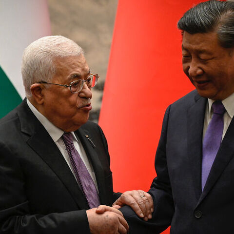 Palestinian President Mahmoud Abbas shakes hands with China’s President Xi Jinping after a signing ceremony at the Great Hall of the People in Beijing on June 14, 2023. 