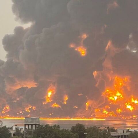 A handout picture obtained from Yemen's Huthi Ansarullah Media Center show a huge column of fire erupting following reported strikes in the Yemeni rebel-held port city of Hodeida opn July 20, 2024. 