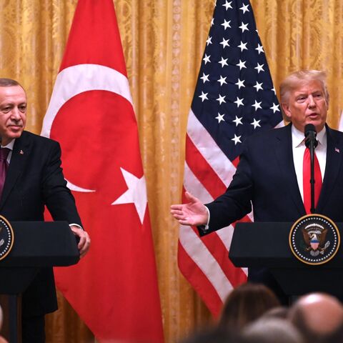 US President Donald Trump and Turkey's President Recep Tayyip Erdogan (L) take part in a joint press conference in the East Room of the White House in Washington, DC on November 13, 2019. 