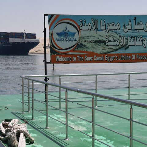 A welcoming sign is placed on the shore of the Suez Canal in the northeastern Egyptian city of Ismailiya, May 27, 2021. 