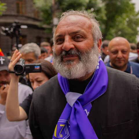 The protest movement leader Archbishop Bagrat Galstanyan participates during the rally demanding the Armenian Prime Minister Nikol Pashinyan's resignation over land transfer to neighboring Azerbaijan, outside the government building in central Yerevan on May 30, 2024. 
