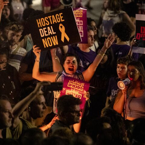 Protesters hold signs during a demonstration calling for a hostage deal with Hamas.