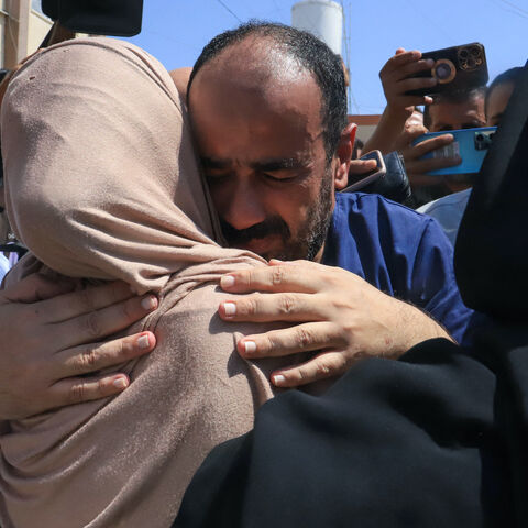 Al-Shifa hospital director Mohammed Abu Salmiya who was detained by Israeli forces since November, is welcomed by relatives after his release alongside other detainees, at Nasser hopsital in Khan Yunis in the southern Gaza Strip July 1, 2024, amid the ongoing conflict between Israel and the Palestinian Hamas militant group. 