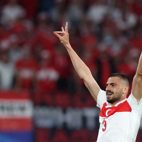 Turkey's defender Merih Demiral makes a controversial hand gesture as he celebrates scoring his team's second goal during the UEFA Euro 2024 round of 16 football match between Austria and Turkey at Leipzig Stadium, Leipzig, Germany, July 2, 2024.