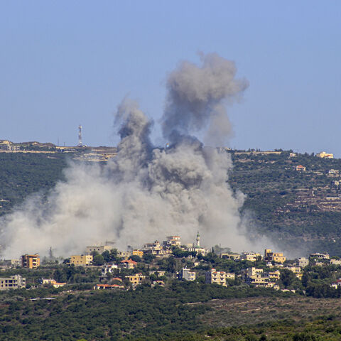 TOPSHOT - Smoke billows following an Israeli airstrike in the southern Lebanese border village of Chihine on July 28, 2024. Fallout from the Gaza war is regularly felt on the Israel-Lebanon frontier, where deadly cross-border exchanges have escalated between Israeli troops and mainly Hezbollah fighters. (Photo by KAWNAT HAJU / AFP) (Photo by KAWNAT HAJU/AFP via Getty Images)